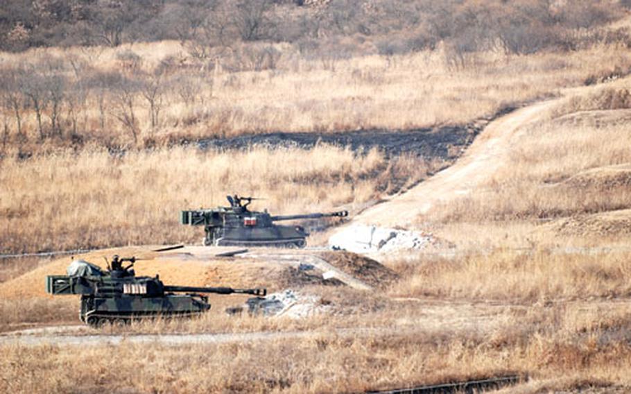 Paladin crews line up to fire their 155mm guns at targets up to 1,750 yards away in the surrounding mountains at Rodriguez Range last week.