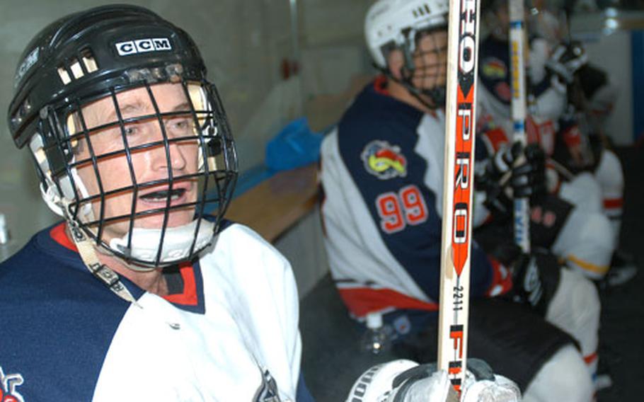 Col. Terrence J. O'Shaughnessy, 35th Fighter Wing and Misawa Air Base, Japan, commander, catches a breather on the bench Sunday night during an ice hockey game at the Misawa Ice Arena. O'Shaughnessy is the only American on the Misawa Seniors. He joined to meet people in the community and because he loves the game. The hockey league is open to other Americans, as well.