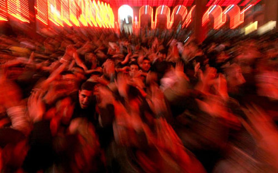 People beat their chests as a sign of grief for Imam Hussein in the Shiite holy city of Karbala, 80 kilometers (50 miles) south of Baghdad, Iraq, Thursday. Ashoura, the 10th day of the Islamic month of Muharram is marked by Shiite believers as the day that Imam Hussein, the grandson of Prophet Muhammad, was killed in the Battle of Karbala in the year 680 A.D. and more than a week of Ashoura observances are scheduled to climax Friday night through midday Saturday.