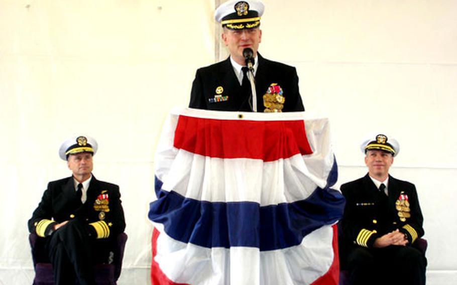 Capt. Joseph W. Kuzmick prepares to relinquish command of the USS Mount Whitney, 6th Fleet flagship, to Capt. Owen P. Honors, at right, during a ceremony Friday. Vice Adm. James A. Winnefeld Jr., the 6th Fleet Commander, left, was the guest speaker.