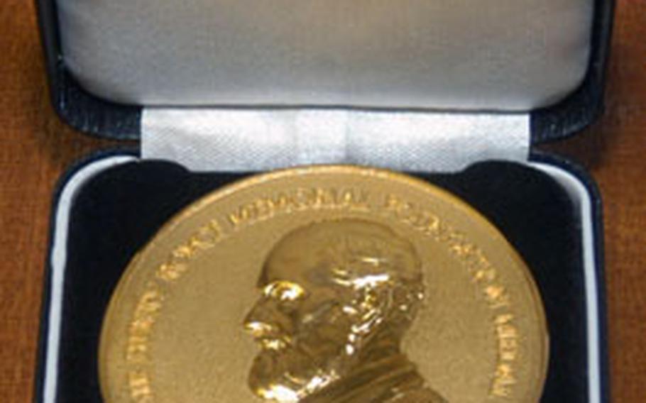The Sir Henry Royce Memorial Foundation medal and a 200-pound check were presented to Gutteridge for his development of the carrom table.