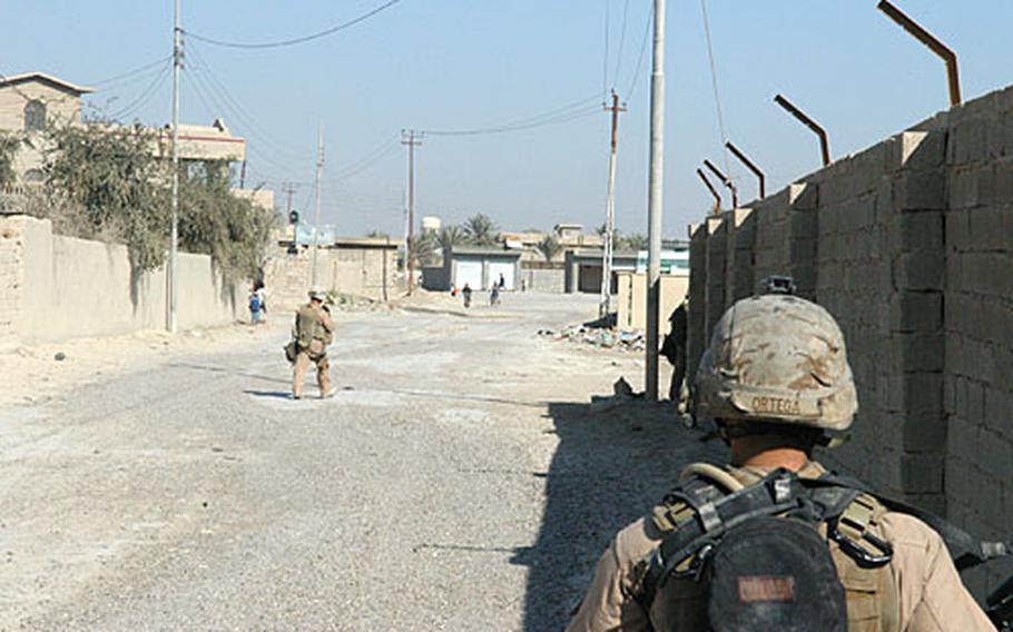 Marines with 2nd Squad, 2nd Platoon, Company L, patrol their area of operations in Karmah earlier this week. The company commander gave each squad its own area to patrol daily in the hope of putting the same Marines in front of the same locals each day.