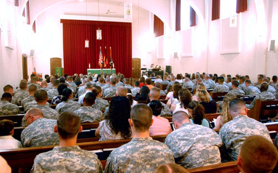 Mourners gather for a memorial service on July 19 at Ledward Chapel in Schweinfurt, Germany. A year into the deployment of Schweinfurt’s 2nd Brigade, more than 50 of tis soldiers have died in Iraq.