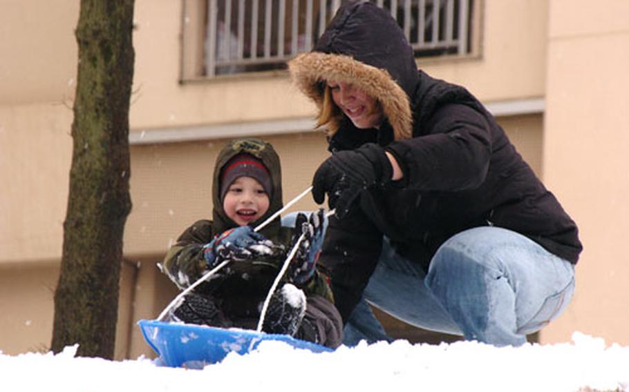 Becky Martinez and her son Elliot, 4, enjoy the snow Wednesday at Yokota Air Base, Japan.