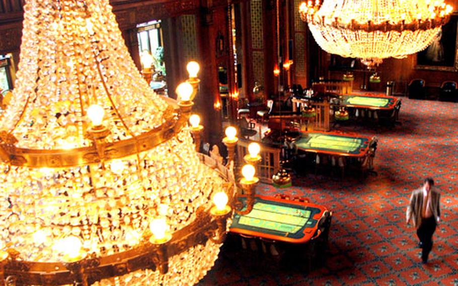 The casino in Wiesbaden, Germany, has an elegant hall with walnut walls, thick carpets and fancy chandeliers.