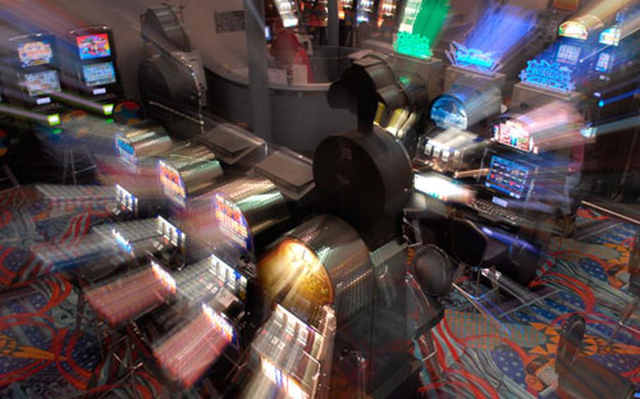 Brightly lit bingo machines, some with military themed displays, entice spectators at the Ramstein, Germany, enlisted club Dec. 20th, 2007. A bill has been introduced in Congress that would eliminate gambling on all military bases overseas, to include slot machines and bingo games in military clubs.