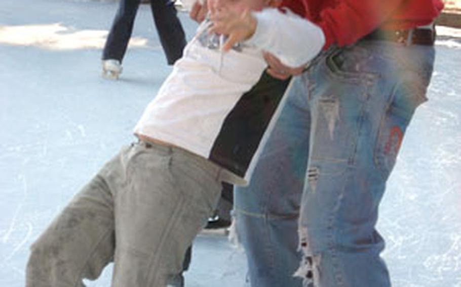 A park staffer helps a young skater to his feet recently.