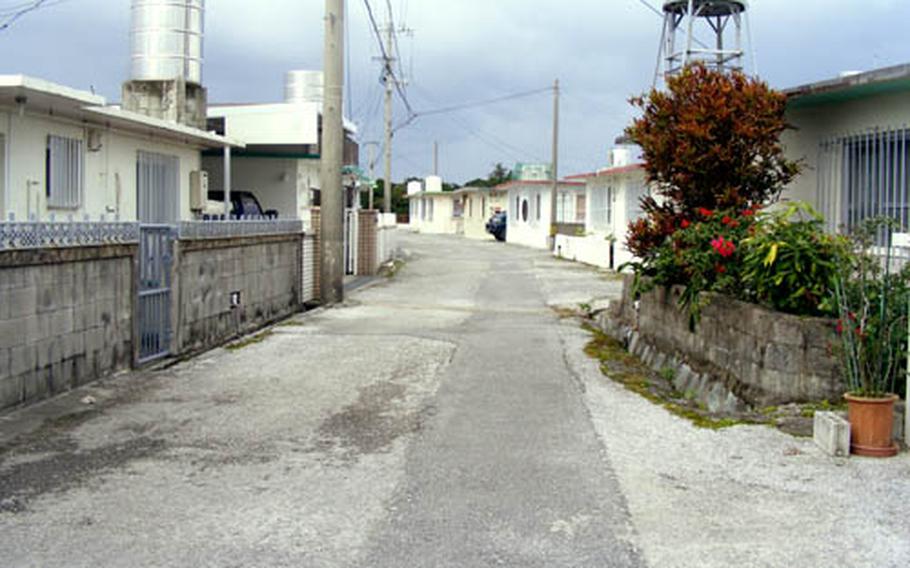 Residents of this Kitanakagusuku housing area say Marine Staff Sgt. Tyrone Luther Hadnott was a "quiet" man who lived by himself and frequently entertained Japanese women in his home. He apparently was so popular that one girlfriend got into a fight when she arrived to find Hadnott with another woman, a neighbor said.