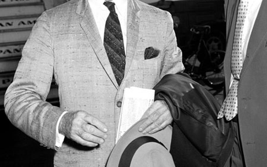 James F. Byrnes talks with a reporter after arriving in Frankfurt in September, 1959.