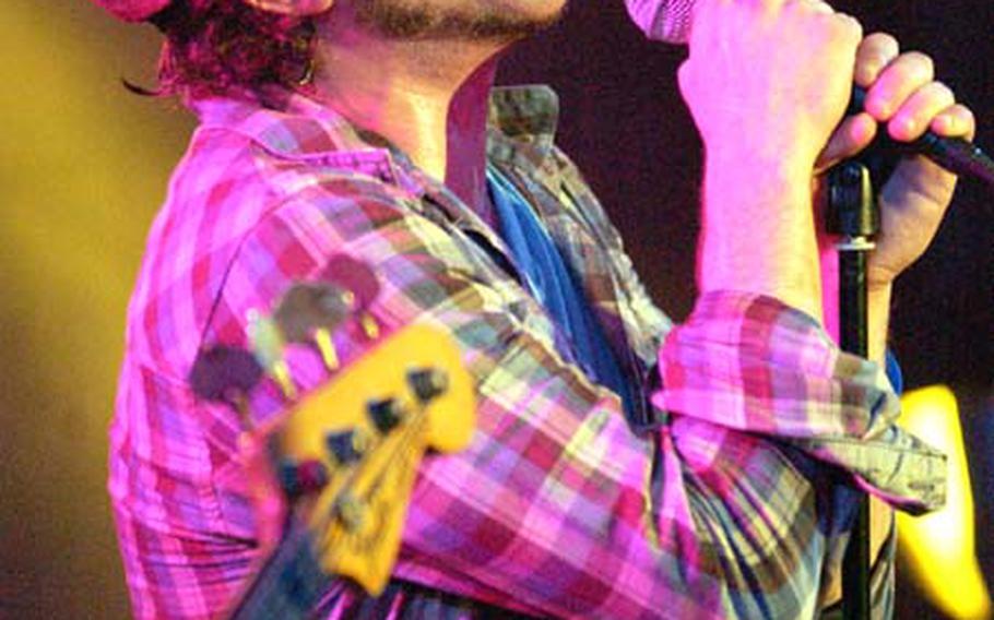 Elliott Yamin, the third-place finisher in Season 5 of "American Idol," sings his hit song "Wait For You" on Wednesday evening at Ramstein Air Base, Germany&#39;s enlisted club.