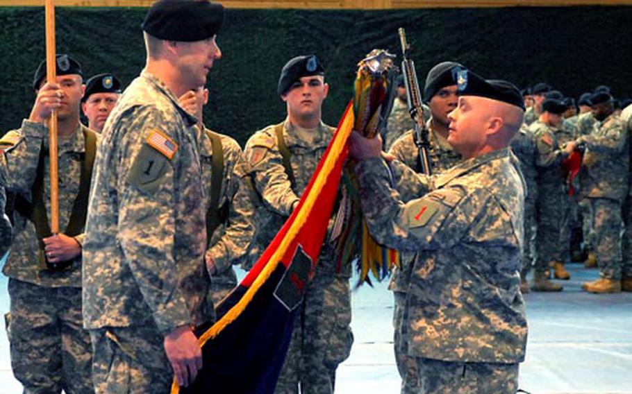 Col. Jeffrey Sinclair, left, commander of the 2nd Brigade Combat Team, 1st Infantry Division and Command Sgt. Maj. Steven McClaflin roll up the unit&#39;s colors, as it was replaced by the newly reactivated 172nd Infantry Brigade. With the return of the brigade&#39;s colors to the U.S., the long history of the 1st Infantry Division in Europe comes to an end.