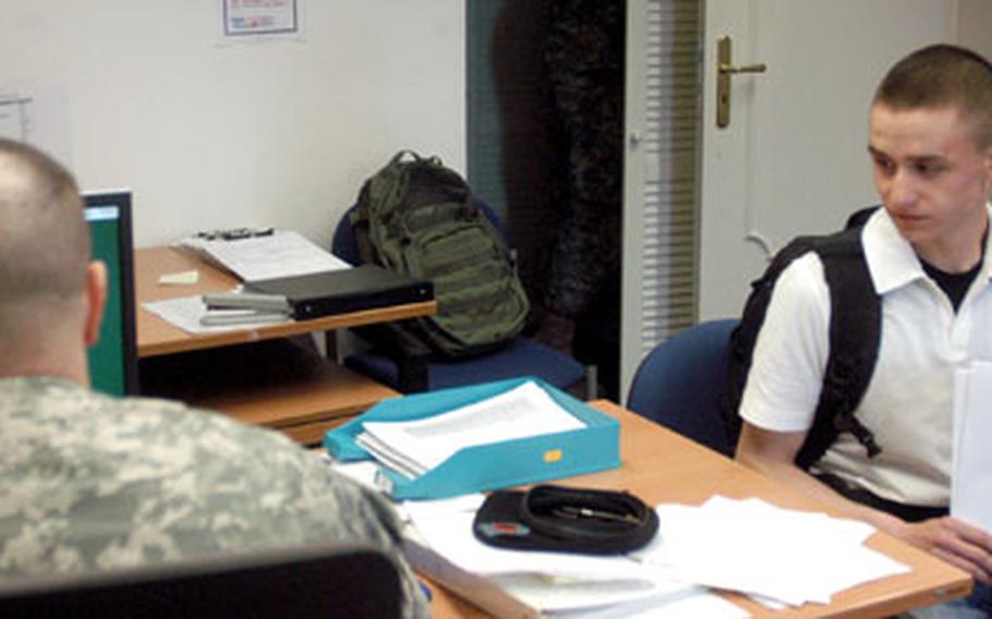 Pvt. Dustin Hoffman, 18, of Boise, Idaho, checks in Monday with a member of the 64th Replacement Company, which has relocated to the Sheraton Hotel at the Frankfurt International Airport in Germany. On Tuesday, the company that meets and greets inbound soldiers inactivated, taking on a new name: the U.S. Army Europe Soldiers and Family Reception Center.