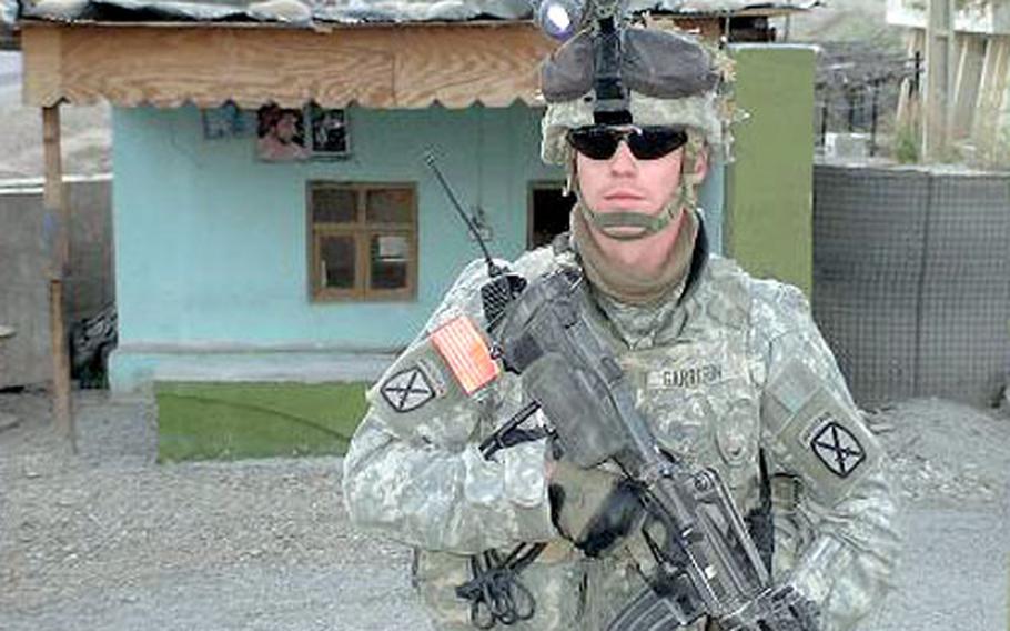 Army Spc. Brandon Garrison, doing base security patrol while at Forward Operating Base Jalalabad, Afghanistan, in June 2006.
