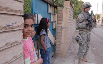 An Iraqi girl turns to check out the camera