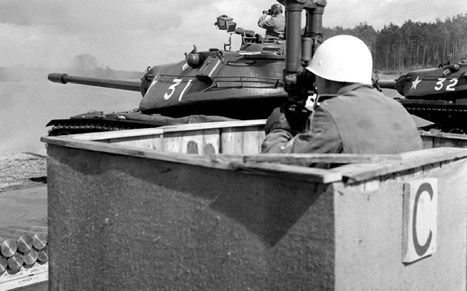 An observer keeps his eye on the target during the firing competition.