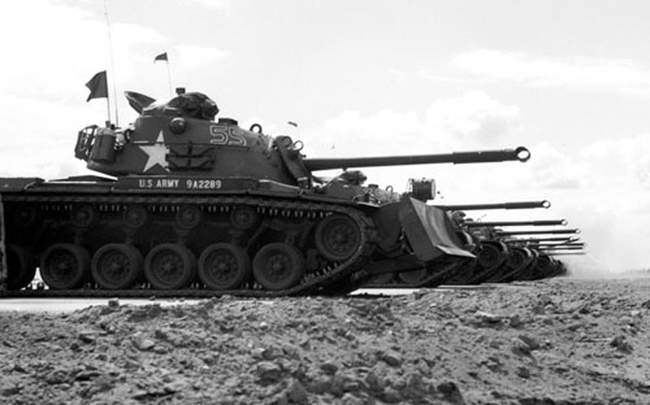 Tanks line up at the target area.