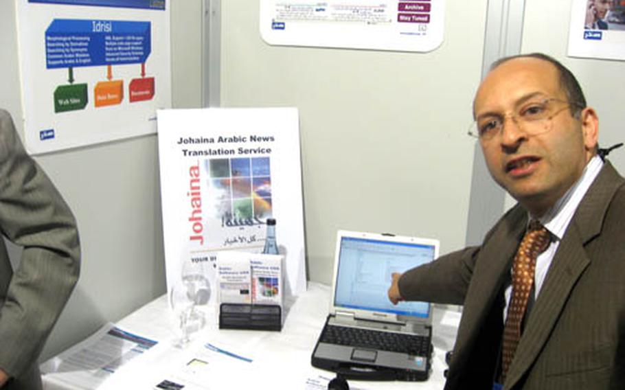 Rami Safadi, chief technical officer for Sakhr Software USA, gestures to his laptop computer where words he has spoken in Arabic have been translated into English on the computer screen and audibly through speakers. Safadi was one of the vendors on Wednesday attending the AFRICOM/Business Transformation Agency expo in Stuttgart, Germany.