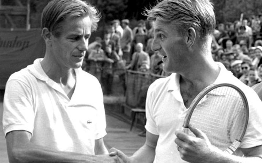 Hoad, right, is congratulated by Larsen.
