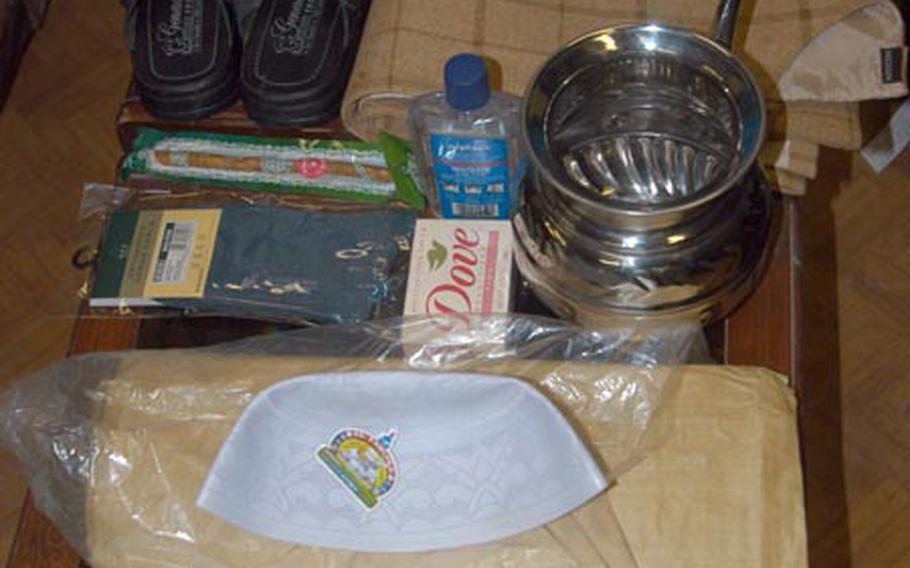 This picture illustrates some of the items — clothing, a prayer rug, a water jug and more — that make up the “mullah kit” that soldiers from the 1st Battalion, 503rd Infantry Regiment have given to the Islamic leaders of communities in Paktika province.