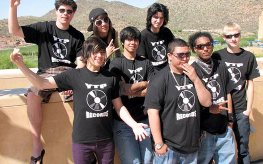Having recently returned from their performance in Arizona, and having already planned a Guam trip, members of Yokosuka Teen Program Records are creating a Navy-wide buzz. Top, left to right: D.J. Mincks, Sean (Pat) Groves, Brian Walters. Bottom, left to right: Derry Devlin, John Bollinger, Andrew (Andreaz) Brenyo, Blake Rogers, Jordan Krunich.