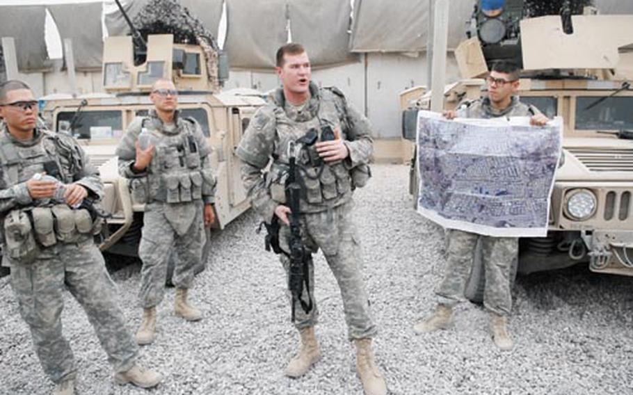 2nd Lt. Jedidiah Wentz, a platoon leader with Troop A, 1st Battalion, 75th Cavalry Regiment, gives a briefing prior to a patrol in the Gazaliyah district of western Baghdad. The troop took over a larger section of the district several months ago after other units in the battalion pushed into Shiite areas to the north.