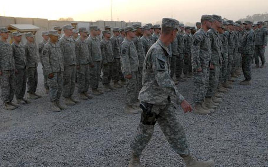 Members of Company C, 1st Battalion, 75th Cavalry Regiment file into a chapel at Camp Liberty in Baghdad to pay their respects to one of their own.- Sgt. John Aragon, 22, was killed by a roadside bomb on June 12.
