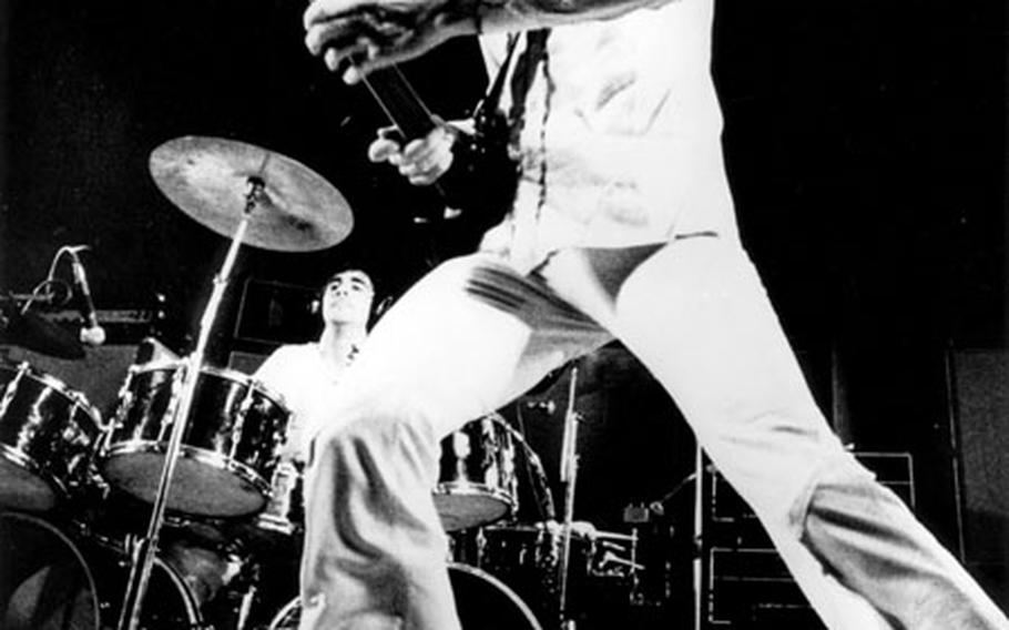 Pete Townshend (foreground) and Keith Moon of The Who, onstage in 1972.