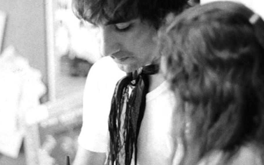 Keith Moon signs an autograph.