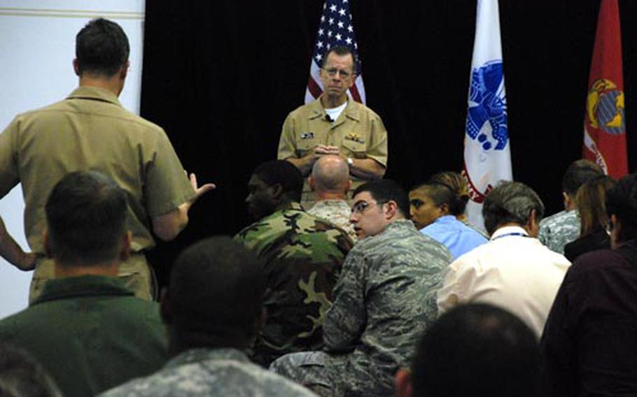 Chairman of the Joint Chiefs of Staff Adm. Mike Mullen, center, listens to a question during a town hall meeting at the Africa Command headquarters Thursday in Stuttgart, Germany. Mullen told those in attendance that the U.S. must be more flexible in today's ever-changing world.