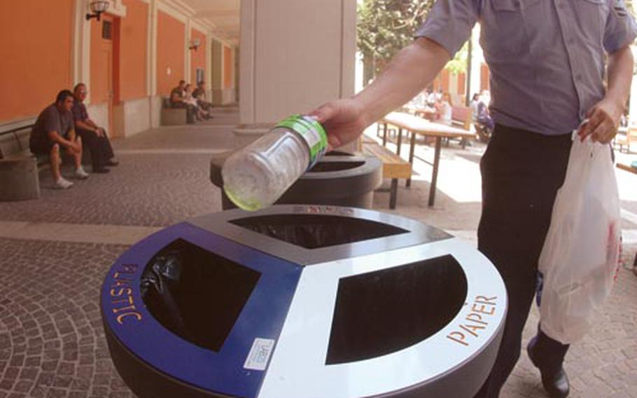 Petty Officer 2nd Class Herbert Matcke tosses his empty drink plastic bottle into one of many new recycling receptacles put up in recent weeks at the U.S. Navy’s Capodichino base in Naples, Italy. With the Italian city in the midst of yet another trash crisis, the U.S. Navy is beefing up efforts to make it easier for personnel to recycle – and mitigate contributing to the tons trash that has piled up on Neapolitan streets since mid-December.