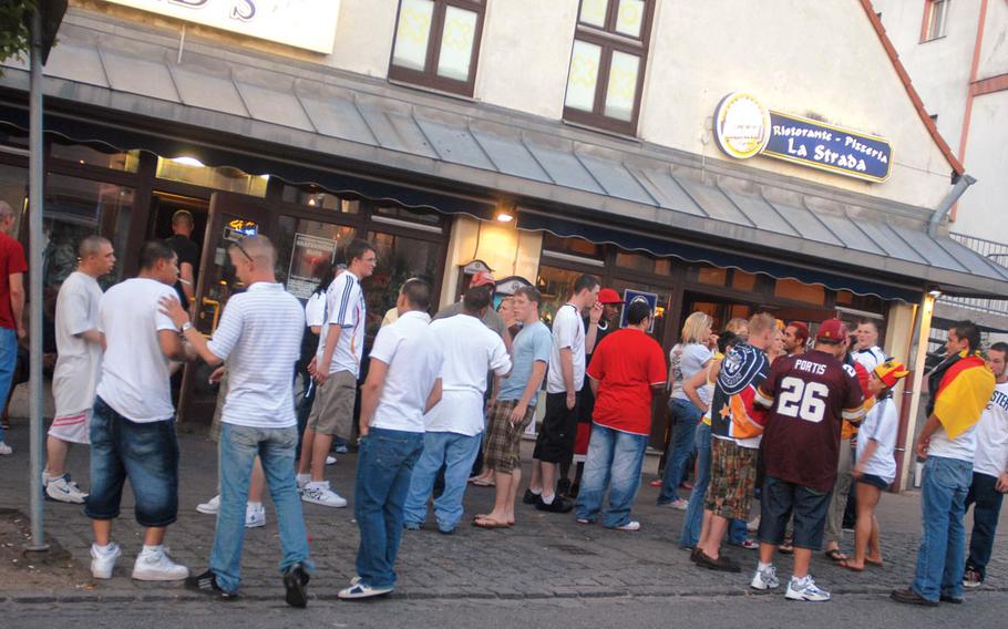 Americans gather in the street in Grafenwöhr, Germany, during a break in the action in the Euro 08 soccer match between Germany and Spain on Sunday.