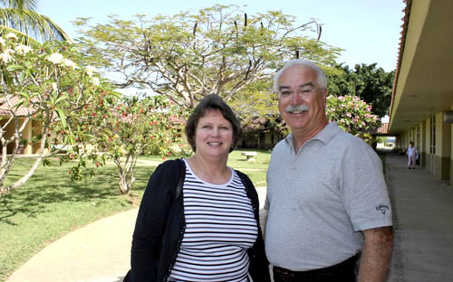 Kathy Einhorn, principal, and Jay Gilbo, assistant principal, pose in W.T. Sampson Elementary School&#39;s courtyard. The two are in charge of the high school and elementary school and split their time between the two campuses at U.S. Naval Station Guantanamo Bay.