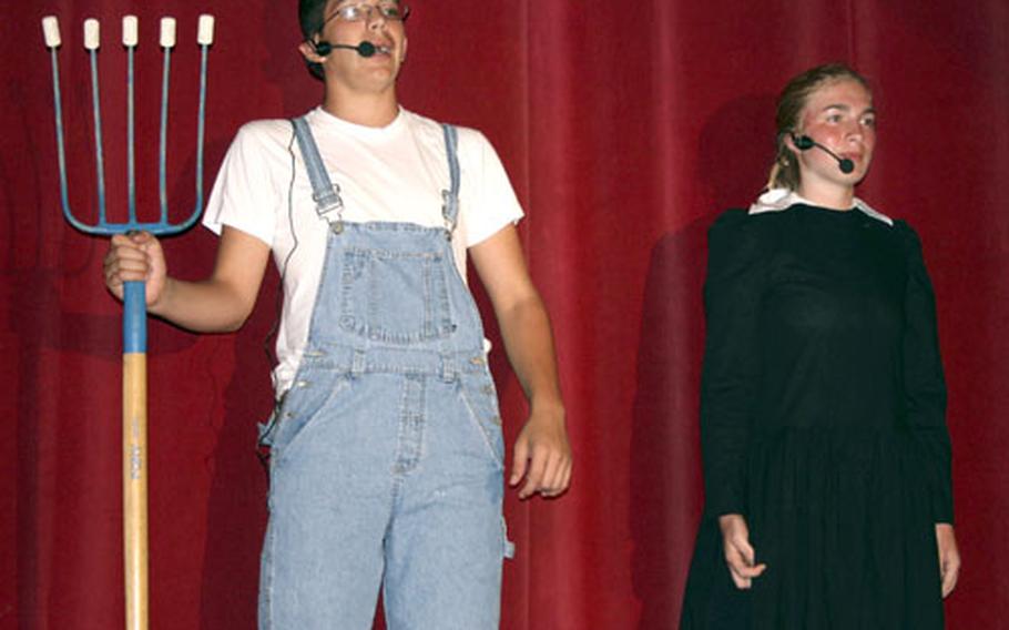 Patrick McCarthy and Caroline Belleman sing about touring America during "Secrets Every Smart Traveler Should Know," a musical comedy revue at W.T. Sampson High School.