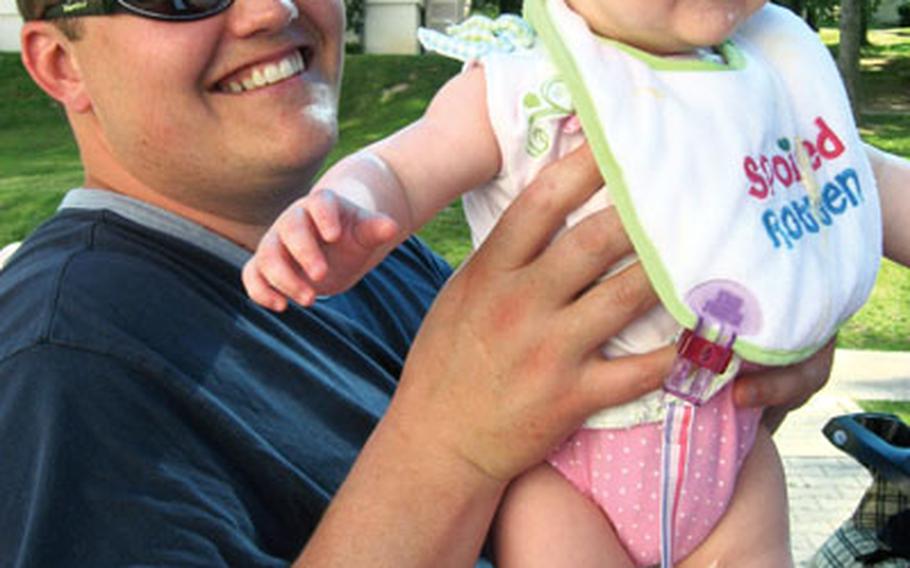 Tech. Sgt. Ryan Terry and his 5-month-old daughter, Brianna. Terry said he lost faith in the immunization office at the Army Health Clinic in Stuttgart, Germany, after his daughter was apparently injected with a vaccination that had been recalled three months earlier.