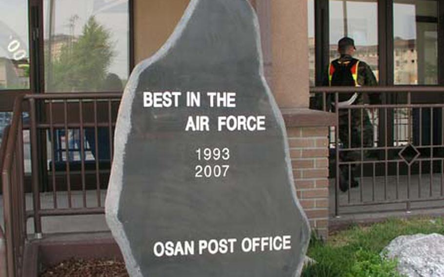 At Osan Air Base in South Korea, officials have erected this stone monument to proclaim that the base post office has been named the best large overseas post office in the Air Force for 2007, an award it also received in 1993.