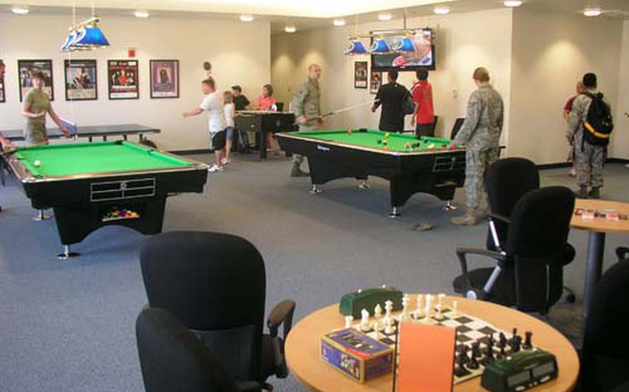 Airmen and other base residents make immediate use of a game room at the community center that opened Wednesday afternoon at Osan Air Base, South Korea.