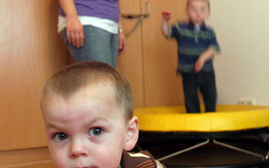 Danielle Wagoner, mother of Connor, front, and Patrick, on the trampoline, supervises her boys during playtime Monday morning. Six months ago the twins, now 2, were diagnosed with autism. It was nearly impossible for Wagoner, wife of Army Capt. Ian Wagoner, to run errands, and the stress of trying to was wearing her down. But a program funded by the Army Family Covenant takes the children off her hands twice a week so she can take care of errands, such as grocery shopping and banking.