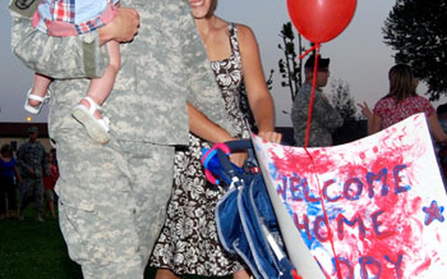 Staff Sgt. Dave Garver, 1st Battalion, 503rd Infantry Regiment (Airborne), his wife, Jill, and 15-month-old son, Payton, leave for home following a welcome home ceremony held for about 250 Vicenza, Italy-based 173rd Airborne Brigade Combat Team soldiers Thursday.