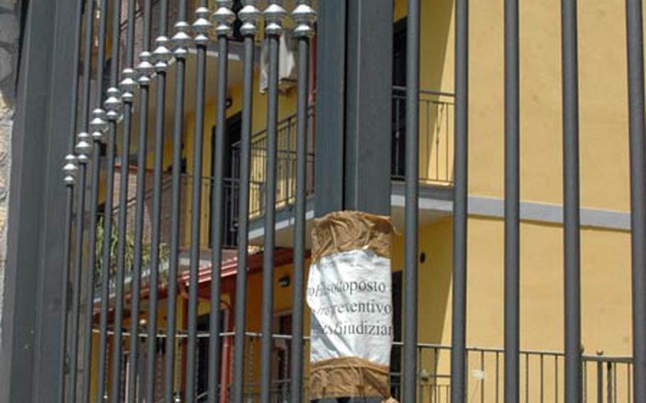 A heavy-duty chain and sign prohibit access to a set of townhouse-style homes on Via Leonardo da Vinci in Gricignano which until March, eight American families called home. They were evicted after an Italian judge ruled that the Italian landlord did not have the proper residential permits. The debacle led to a Housing Office policy change, where now landlords must present a deed and proof of ownership in order for homes to be listed in the office database.