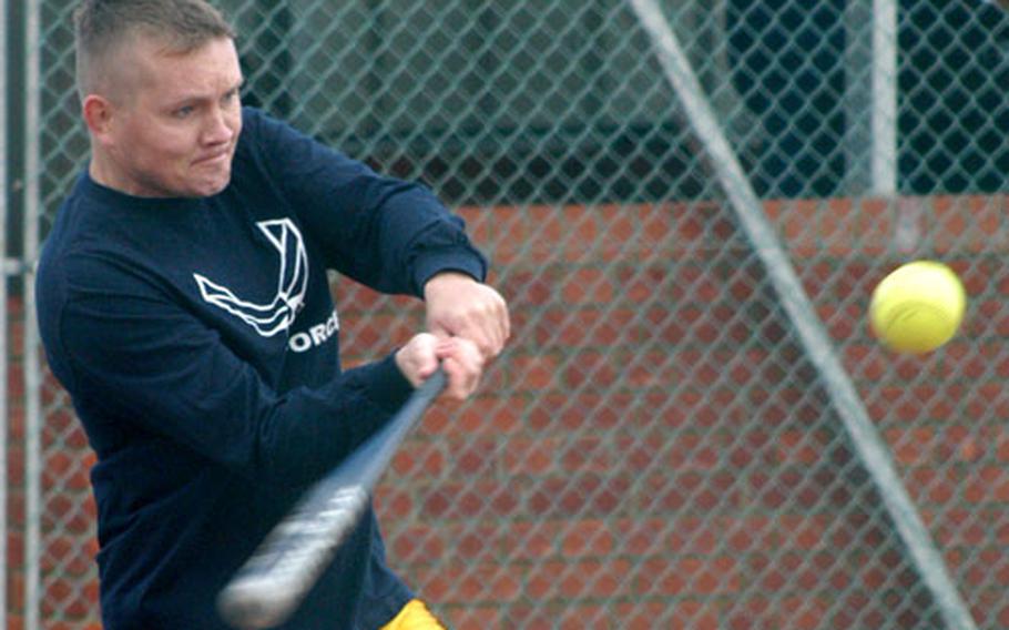 Capt. Aubrey Semrau of Mildenhall’s 100th Force Support Squadron takes a crack at a pitch last week during a game against the 727th Aircraft Maintenance Squadron.