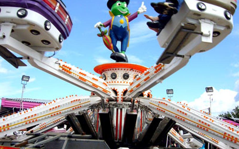 Thrill seekers enjoy one of the carnival rides found along the boardwalk of Hunstanton, a beach town that overlooks the North Sea.