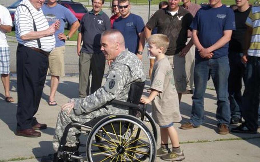 Army Sgt. 1st Class Chris Blaxton, 46, is welcomed home last month by family and friends in Okemos, Mich. The soldier was severely injured by a roadside bomb in Iraq last October. During his recovery, a personal Web site was set up at CaringBridge.org to help him stay connected with loved ones.