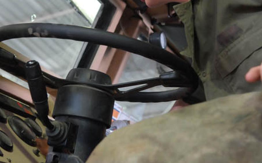 Spc. Keri Pfeifer – a Company B, 10th Brigade Support Battalion mechanic –makes sure that the lights and gauges on a newly repaired MRAP work properly Saturday in Kirkuk, Iraq.