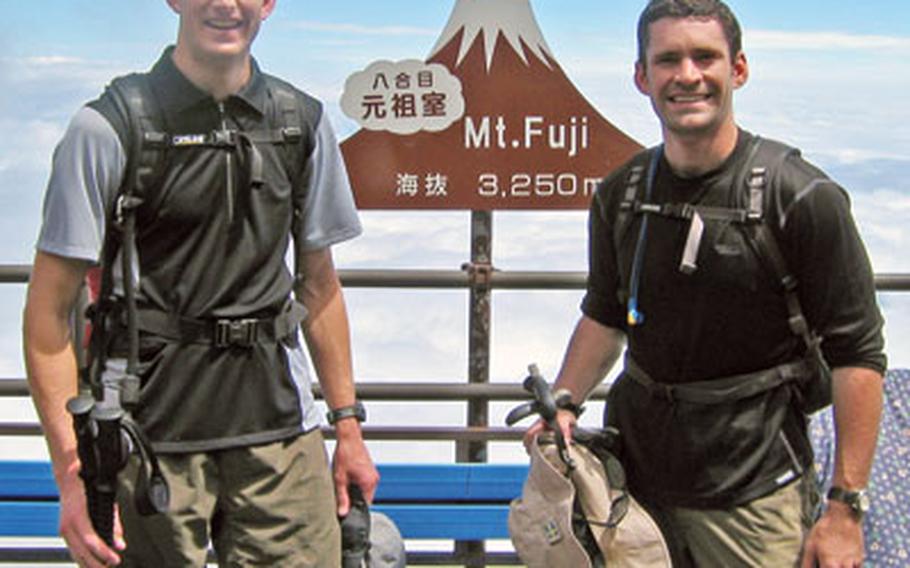 Last year, Navy Lt. Jeff DeGroot, left, and Lt. Doug Szwarc climbed Mount Fuji three times in 24 hours to raise money for a Yokosuka charity. This year, Szwarc and three others have upped the ante to four runs up Japan’s tallest mountain in hopes of doubling last year’s donations.