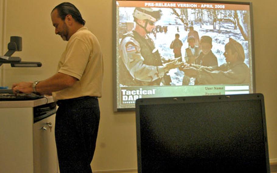 Mike Russell, a project manager with Trofholz Technologies Inc., demonstrates how to use one of the language programs offered at the new Language Lab Resource Center. Trofholz Technologies designed and installed the software, which will be used at labs at camps Foster, Hansen and Schwab.