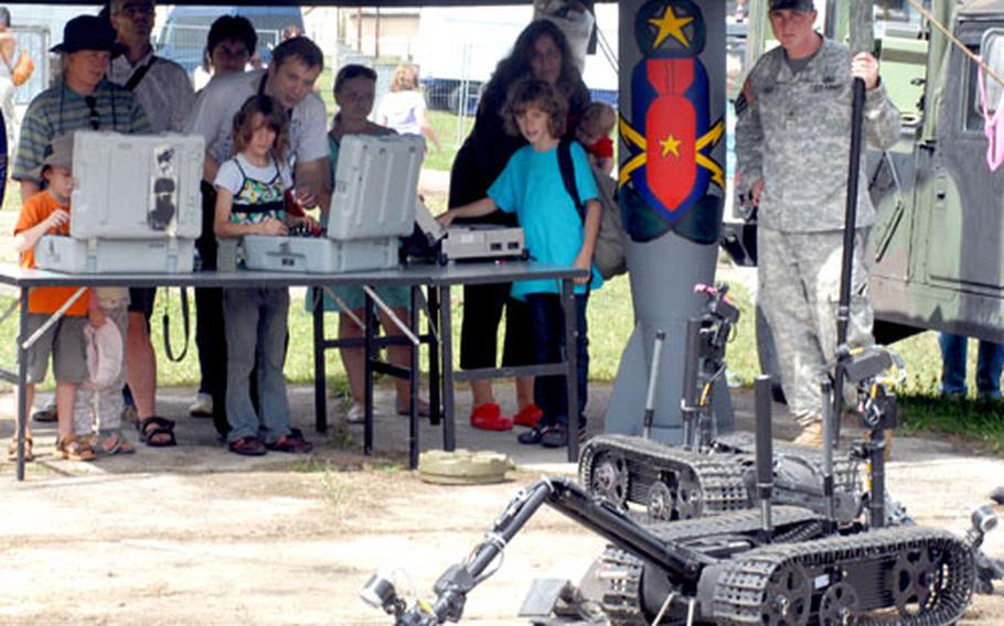 Visitors check out the latest U.S. military robots at Grafenwohr's German-American Volkfest on Saturday.