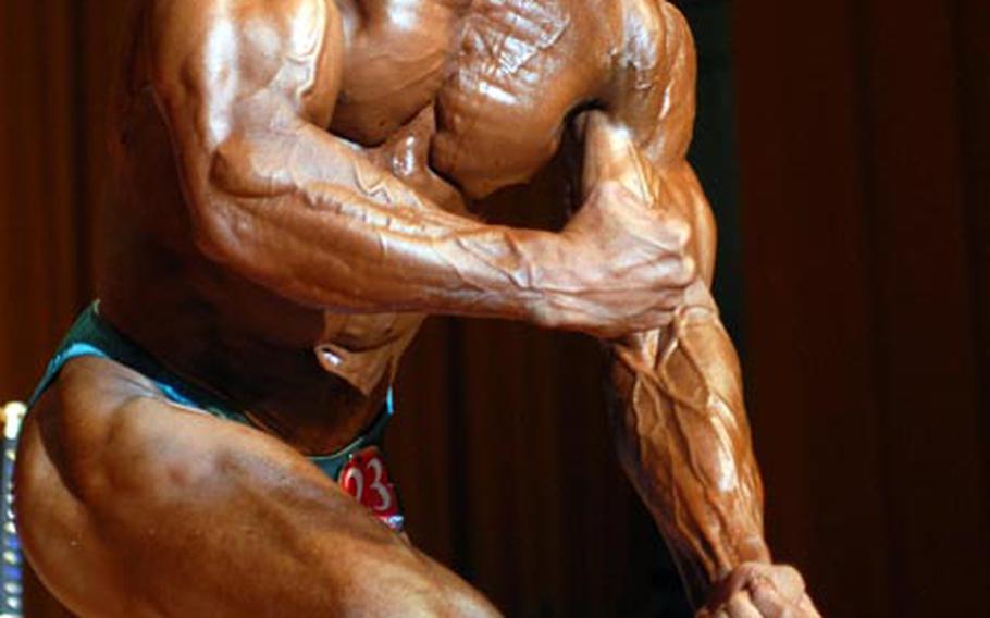 Men's overall champion Tomoya Nakadomari, a Japanese civilian on Okinawa, in Sunday's 13th Far East Bodybuilding Competition at Camp Foster's Butler Theater.