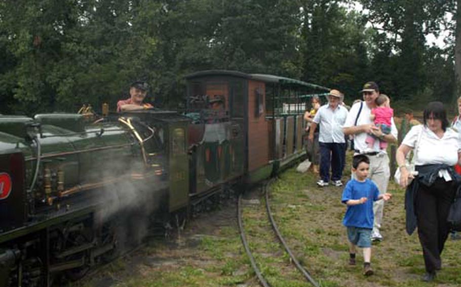 Volunteer Tom Hunt stops at one of several mock rail crossings that loop through Bressingham Steam and Gardens Centre.