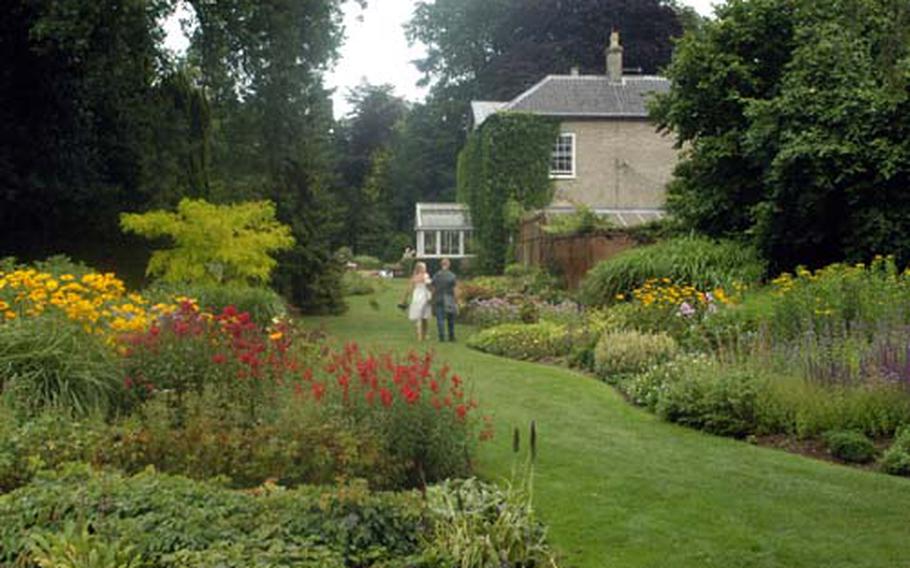 A couple strolls through the Dell Garden at Bressingham Steam and Gardens Centre. Located in Norfolk, near Diss, the family-friendly attraction is also an ideal place for couples to spend the day.