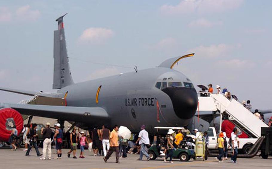 Japanese visitors check out a U.S. Air Force KC-135 Stratotanker on Saturday at the 57th annual Japanese-American Friendship Festival at Yokota Air Base, Japan. The two-day event continued Sunday.
